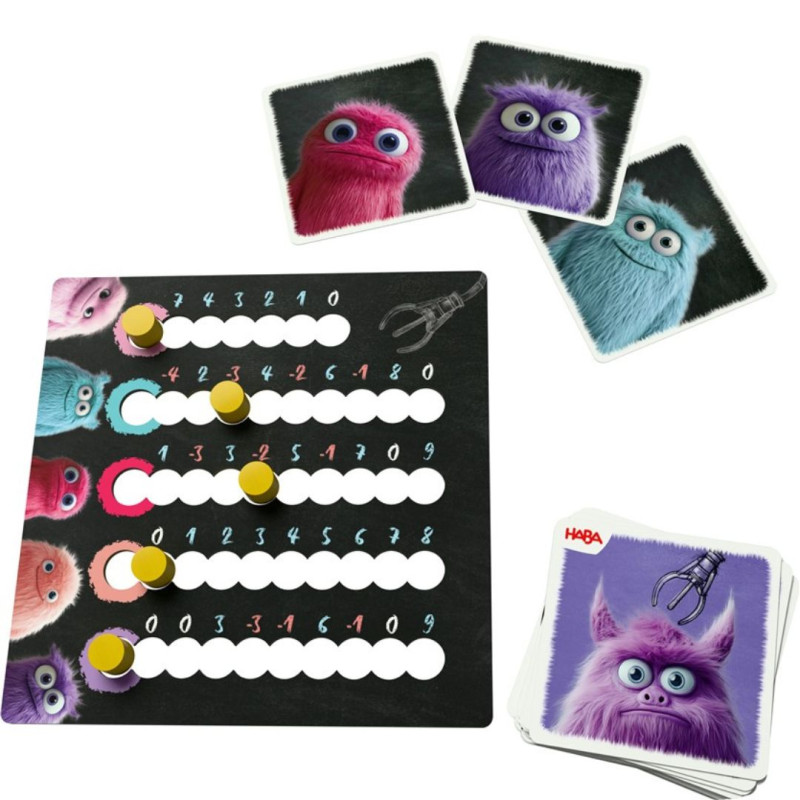 Atrapa Monstruches: tablero negro con fichas amarillas y cartas ilustradas con monstruos de colores vibrantes.