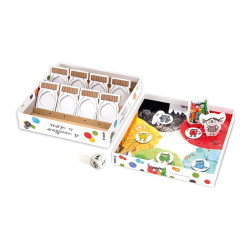 Caja blanca del juego El Monstruo de Colores abierta mostrando fichas ilustradas, un tablero multicolor y un dado.